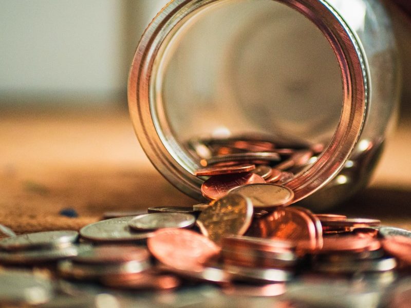 Coins falling out of jar