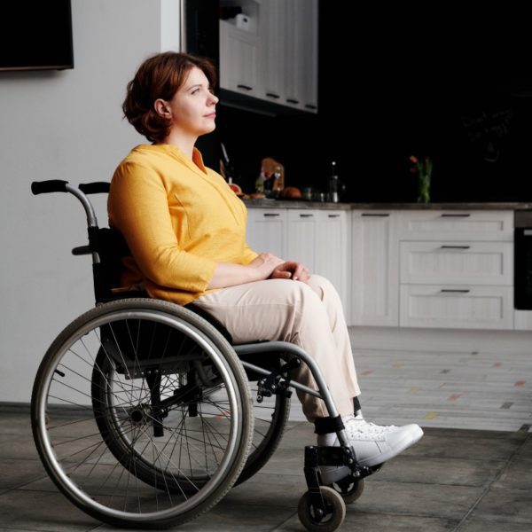 Woman in wheelchair in kitchen