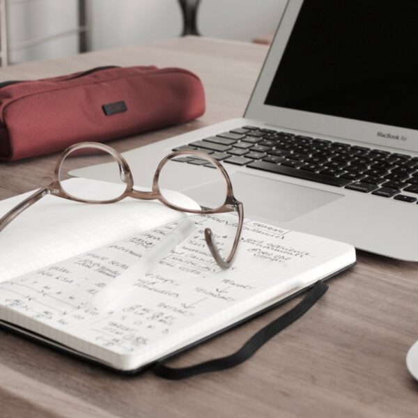 Laptop, notepad and glasses