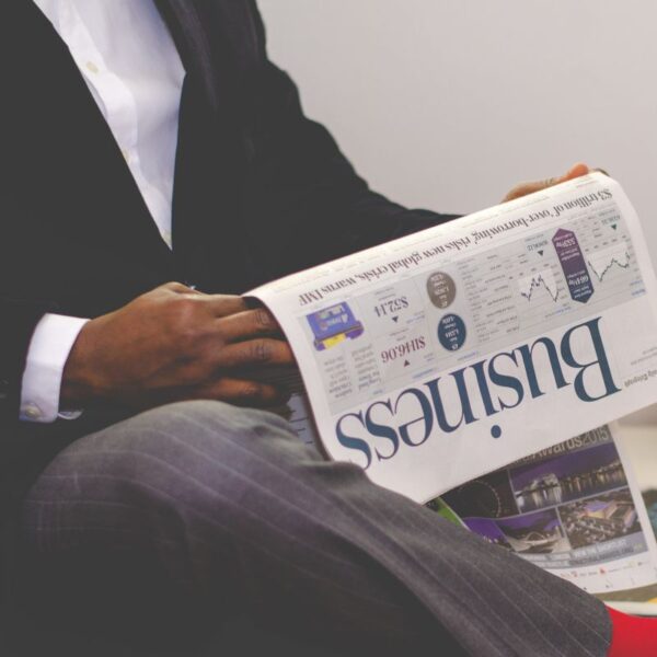 Man holding a business newspaper