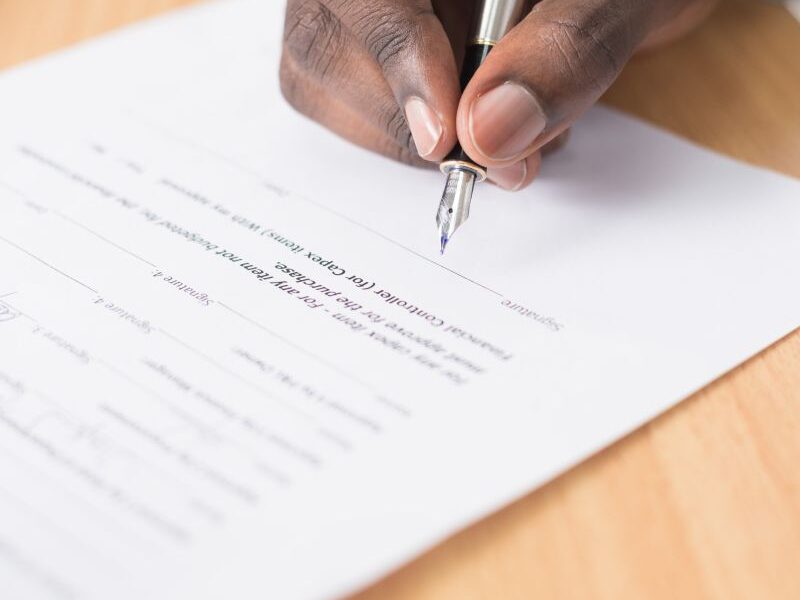 A person signing a document